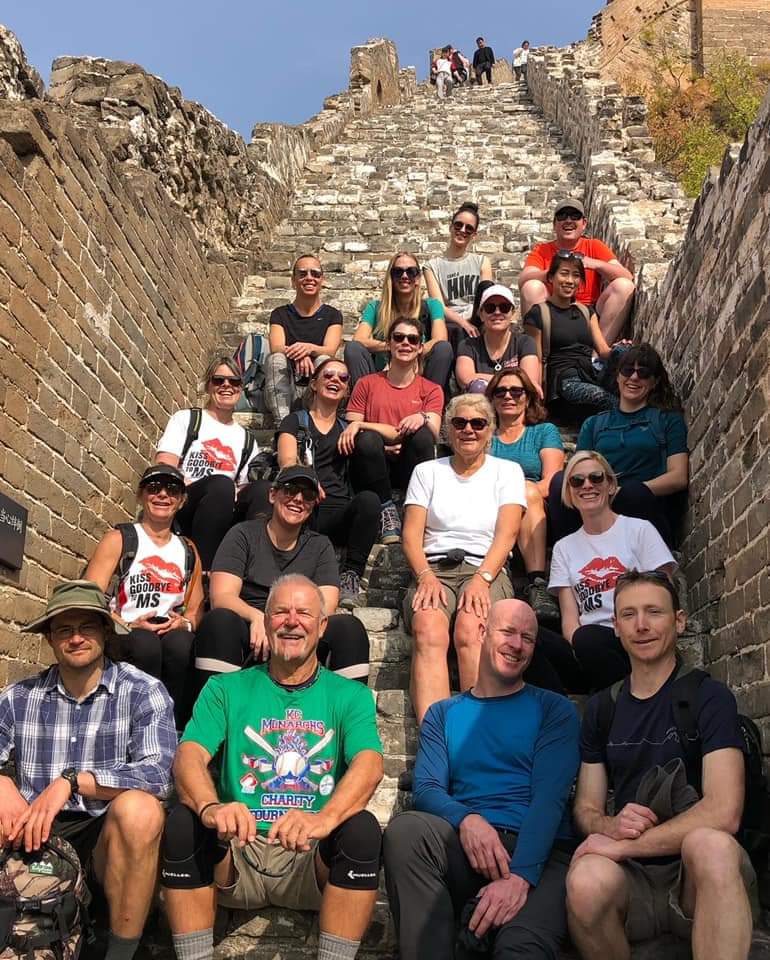 Team MS Australia group photo, sitting on the sets of the Great Wall. Alexia's story.