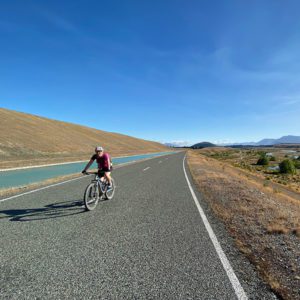 Cyclist coming down a wide highway