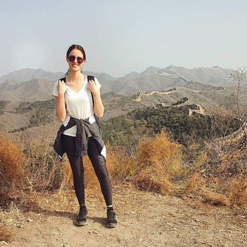 Alexia trekking on the Great Wall of China