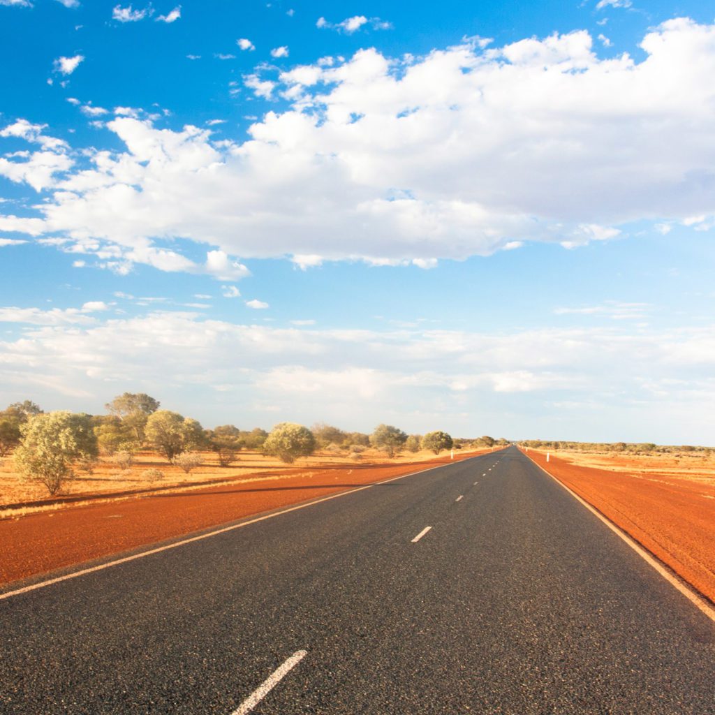 Open road in the middle of the dusty Australian Outback
