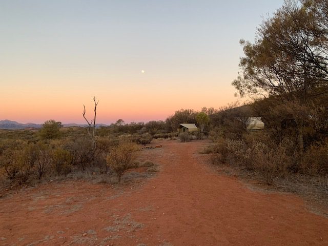 Dusty Outback road at sunrise