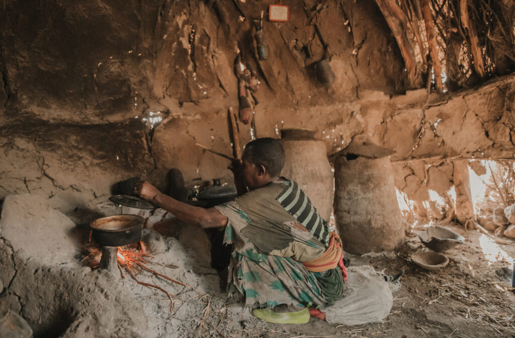 Muluye Fantahun making lunch inside her home. © Martha Tadesse