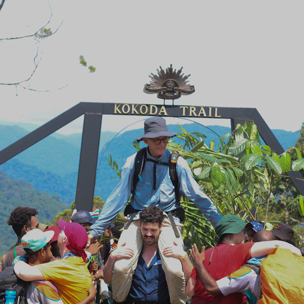 Kokoda trail happy participants in front of Kokoda Trail sign