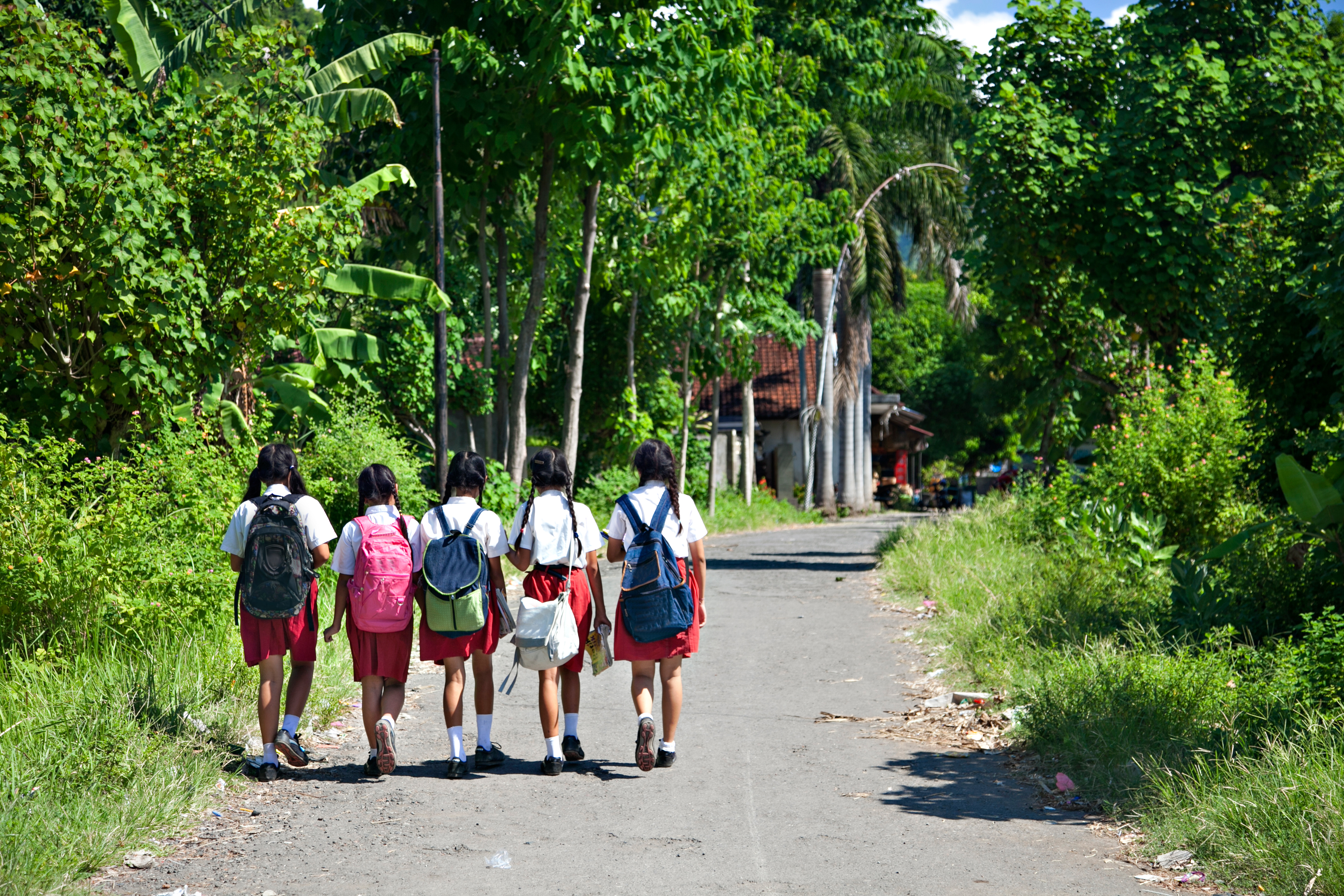 Back,View,Of,Five,Indonesian,School,Girls,Walking,Home,From